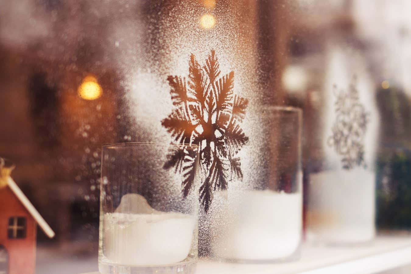 White snowflakes painted on glass of window of store. Decoration for christmas time. Horizontal color image.; Shutterstock ID 521082862; purchase_order: -; job: -; client: -; other: