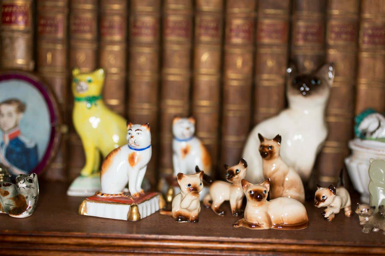 Collection of miniature cat sculptures